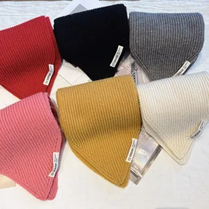 Chunky knit scarf detail showing soft wool texture and colorful winter neck warmer options close up