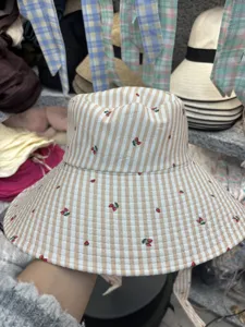 Stylish wide brim bucket hat for women, cute stripe and cherry print fashion cap.