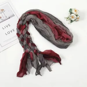 Detailed view of the handmade braided scarf, showing unique texture and ethnic style.