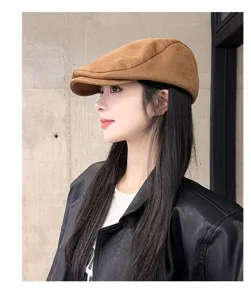 Detailed shot of brown suede ivy cap showcasing fine texture and stylish autumn design look.