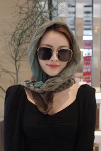 Handmade braided headscarf for women, stylish and versatile green and brown turban design.