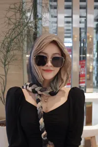 Detailed view of the stylish women's braided headscarf and hood, chic fashion accessory.