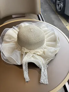 Damen Breitkrempiger Strohhut Sonnenhut mit weißer Spitzen Schleife Strand Urlaub