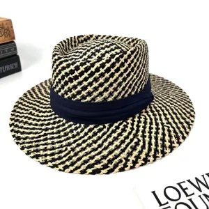 Black white woven straw fedora hat with blue ribbon, stylish summer beach sun hat.