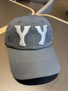 Vintage washed grey baseball cap with bold YY embroidery, casual street style hat.
