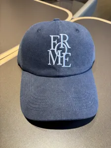 Classic navy blue baseball cap with white embroidered lettering, soft crown design.
