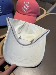 White cotton baseball cap with adjustable metal buckle, soft crown casual sun hat for women and men
