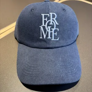 Classic washed blue baseball cap with chic front embroidered lettering casual and stylish daily wear
