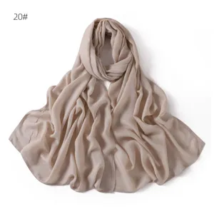 Close-up detail of soft modal cotton solid color scarf, elegant drape, breathable fabric.