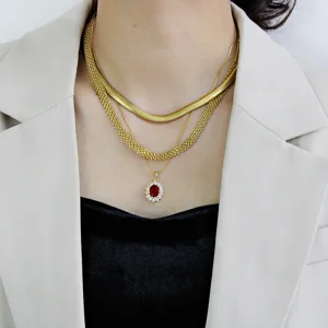 Layered gold stainless steel snake and mesh chain necklace set with elegant red pendant jewelry.