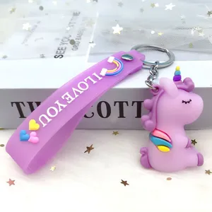 Cute purple unicorn keychain with rainbow strap, detailed close-up shot of bag charm pendant.