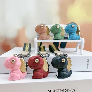 Leuke geometrische dinosauruse sleutelhanger met band, stijlvolle auto tas accessoire.
