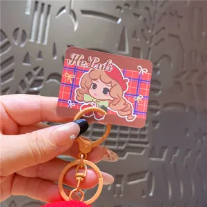 Leuke cartoon pop sleutelhanger met pompon en metalen sluiting, mooie tas accessoire.