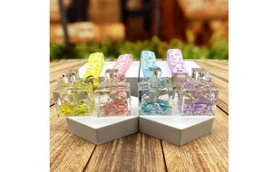 Detailed view of colorful liquid floating unicorn perfume bottle keychains with cute straps.