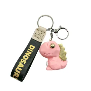 Leuke geometrische dinosaurus sleutelhanger met metalen ring en zwarte band voor auto tas.