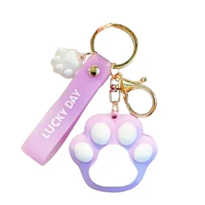 Cute gradient purple cat paw keychain with strap, sweet style bag charm and car key accessory.