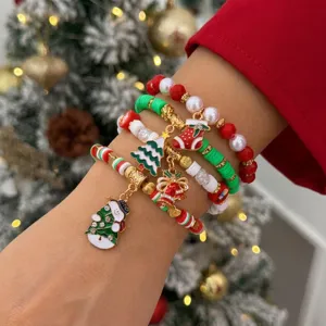 Set di braccialetti natalizi con perline e ciondoli a forma di pupazzo di neve al polso