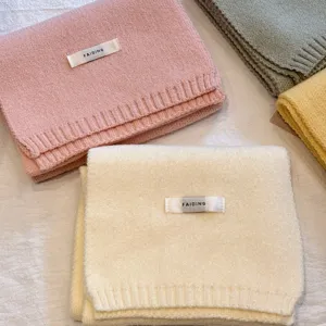 Cozy solid color knitted winter scarf for women, soft warm wool neck wrap versatile daily wear.