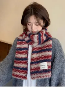 Cozy knit striped scarf for women, warm winter fashion accessory with soft texture.