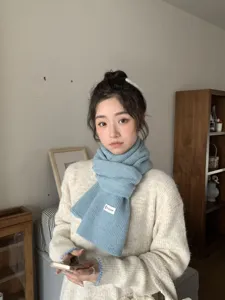 Cozy blue knitted winter scarf for women, soft and warm neck warmer for daily casual wear.