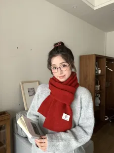 Cozy red knit winter scarf detail, soft warm woolen neck warmer for cold weather daily wear.