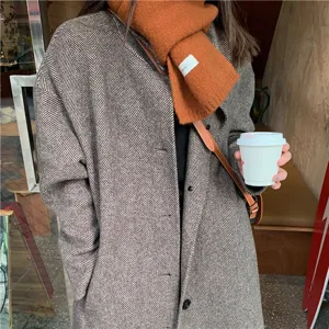 Stylish winter knit scarf and wool coat outfit, warm and versatile Japanese fashion apparel.