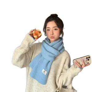 Stylish winter wool knit scarf for women and men, warm and cozy neck warmer in light blue.