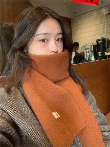 Cozy winter solid color knitted scarf for women, warm and stylish daily fashion wear.