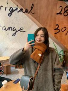 Cozy winter brown knit scarf for women, classic solid color warm neck wrap for daily wear.