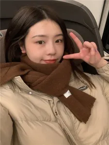 Brown knitted scarf winter warm neckwear detail close up soft cozy fashion daily wear style