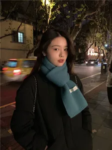 Cozy winter knitted scarf for women, soft solid color design, warm and stylish daily wear.
