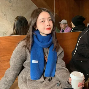 Solid blue knit scarf detail, soft warm winter neckwear accessory for women and men daily wear.