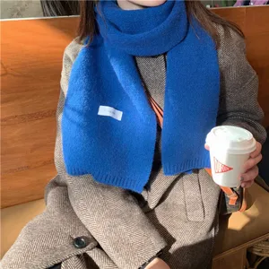 Winter royal blue knit scarf for women, cozy solid color warm neck wrap accessory.