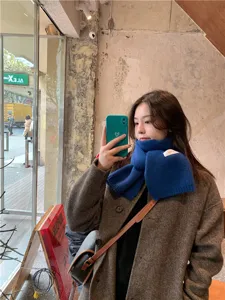 Solid color knitted winter scarf for women, cozy warm neck warmer fashion accessory.