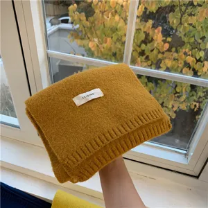 Cozy winter solid color knitted scarf for women and men, warm soft neckerchief accessory.