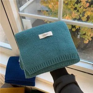 Winter solid color knitted scarf for women and men, warm and cozy classic style accessory.