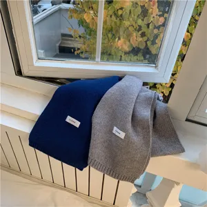 Cozy knit winter scarf detail view, solid color soft warm neck warmer for women and men.