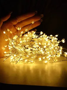 Close-up of warm white LED copper wire fairy lights for festive garden decoration