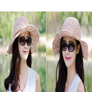 Vue détaillée du chapeau de paille rose pour femme, chapeau de plage d'été ajouré et élégant.
