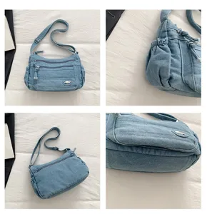 Detailed view of the multi-pocket denim shoulder bag, showing quality fabric and craftsmanship.