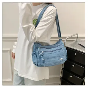Casual denim shoulder bag for women, large capacity vintage crossbody handbag with multi pockets.