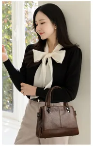 Stijlvolle zachte lederen dames handtas, elegante bruine schoudertas voor dagelijks.