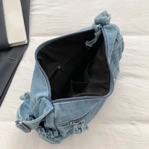 Large capacity denim shoulder bag for women, retro casual crossbody bag with multi-pockets.