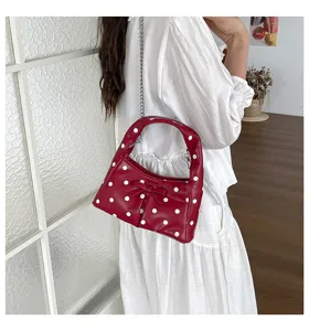 Red polka dot shoulder bag with cute bow and metal chain strap, casual retro women handbag.