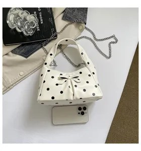 White polka dot hobo bag with bow and chain strap, casual vintage crossbody shoulder bag for women.
