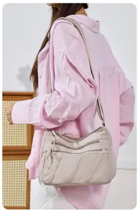 Detailed view of women casual multi pocket shoulder bag, durable nylon fabric cross body daily.
