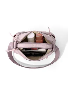 Washed nylon women crossbody bag with double layer capacity and versatile shoulder design.