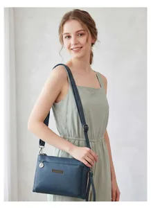 Stylish PU leather crossbody shoulder bag for women, multi-compartment casual handbag.