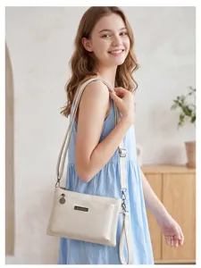 Chic women's PU leather crossbody shoulder bag with multi-compartment design and elegant style.