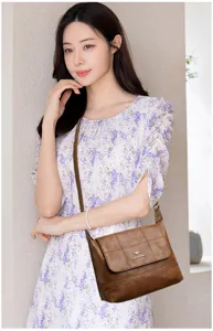 Vintage soft leather crossbody bag for women, elegant shoulder bag with chic design.